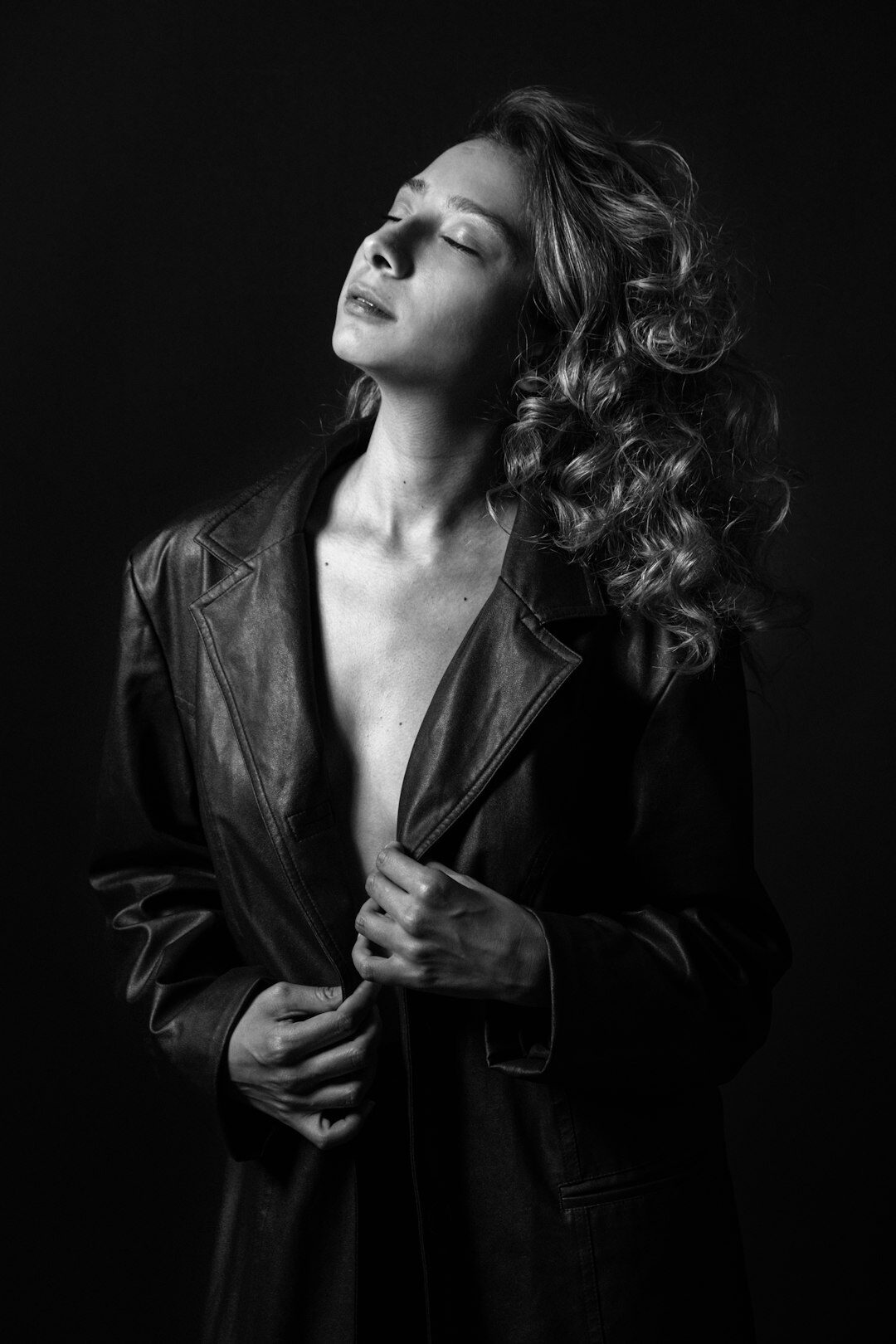 Studio portrait of a European woman in her forties wearing a blazer